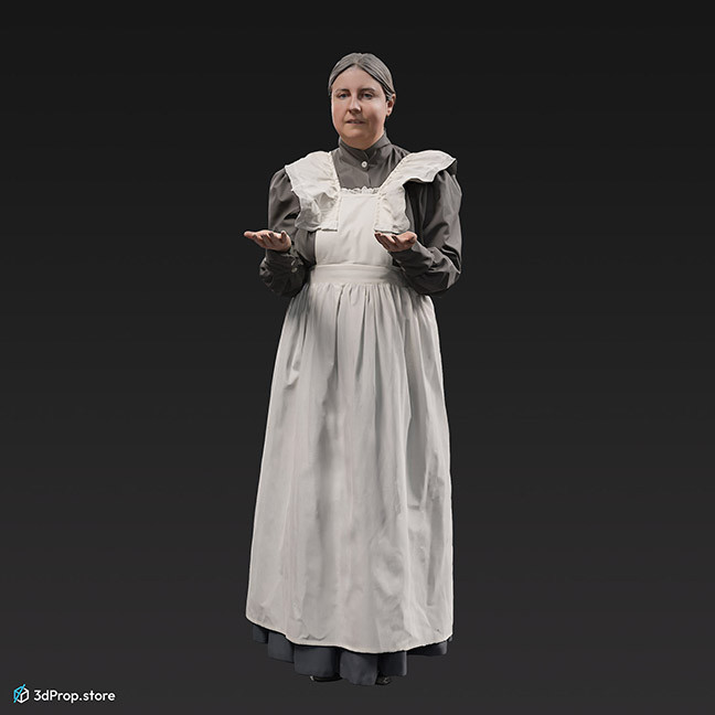 3D scan of a standing, middle-aged maid, wearing a white apron and a grey long-sleeved dress underneath, and she is holding a silver serving tray, from the 1910s, Europe. 
Probably a noble family's maid.